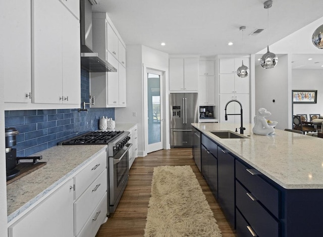 301 Eocene, Horseshoe Bay, TX 78657 - kitchen with high quality appliances, a sink, wall chimney exhaust hood, white cabinetry, and a large island with sink