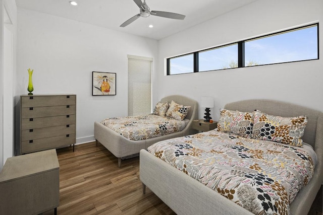 301 Eocene, Horseshoe Bay, TX 78657 - bedroom with wood finished floors, recessed lighting, ceiling fan, and baseboards