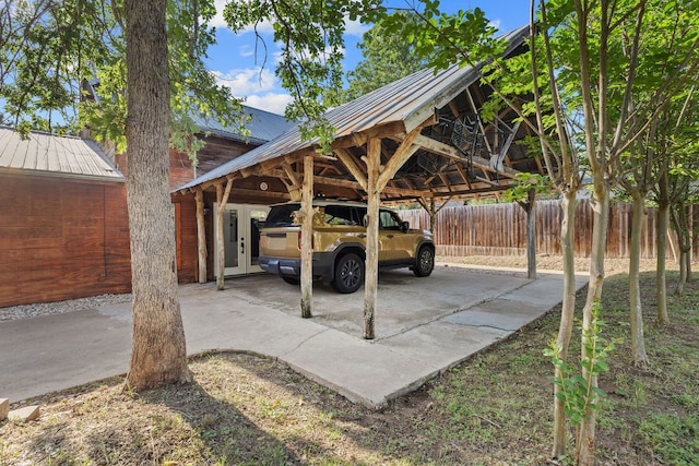 view of car parking with fence