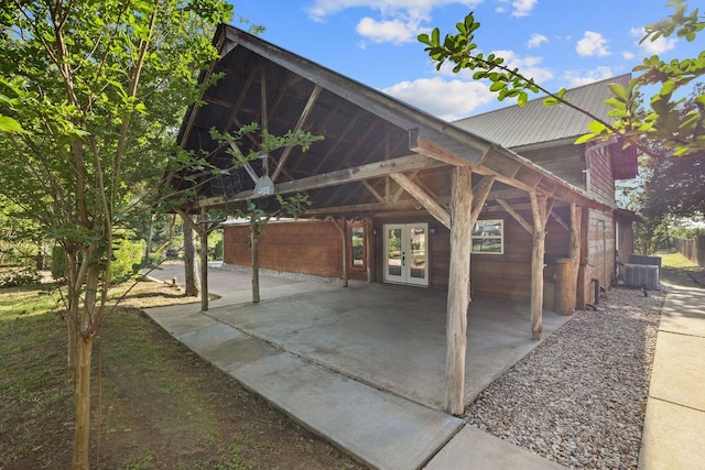 view of patio with french doors and central AC