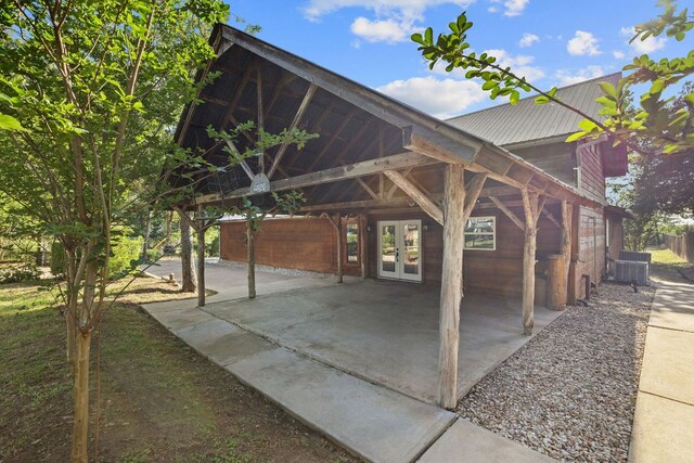 969 N State Highway 95, Bastrop, TX 78602 - exterior space with french doors, a metal roof, and a patio area