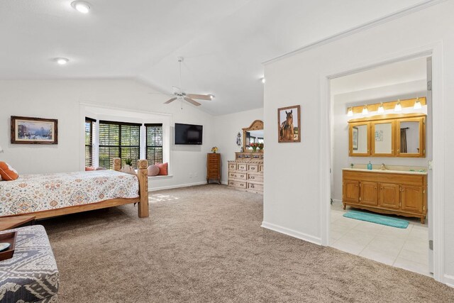 969 N State Highway 95, Bastrop, TX 78602 - bedroom with light colored carpet, vaulted ceiling, and ensuite bathroom