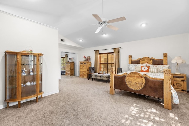 carpeted bedroom featuring vaulted ceiling, ceiling fan, and baseboards