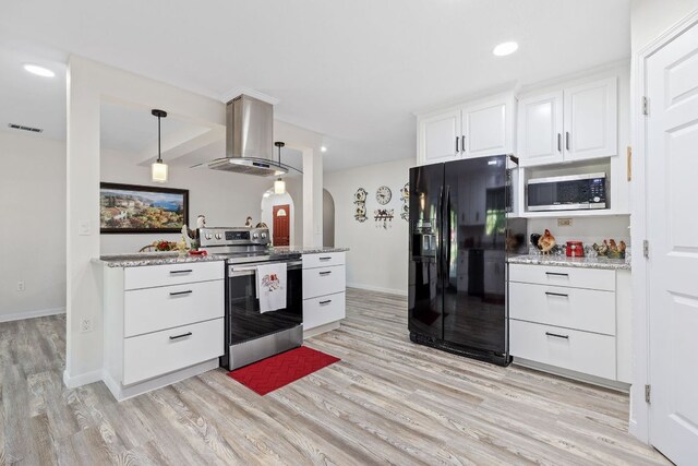 kitchen featuring appliances with stainless steel finishes, island exhaust hood, arched walkways, light wood-style floors, and white cabinets