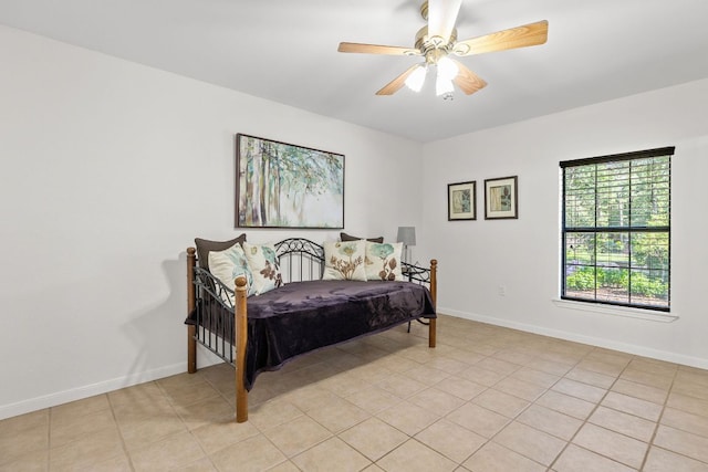 bedroom with baseboards and ceiling fan