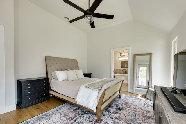 1305 Quail Ravine, Round Rock, TX 78664 - bedroom with vaulted ceiling, light wood finished floors, connected bathroom, and ceiling fan