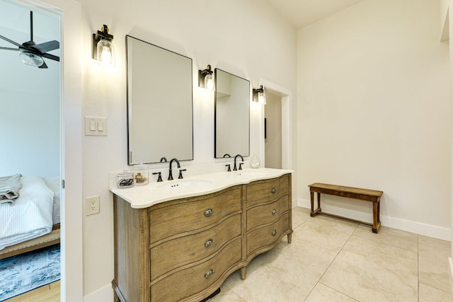 1305 Quail Ravine, Round Rock, TX 78664 - ensuite bathroom featuring a ceiling fan, double vanity, baseboards, and tile patterned floors