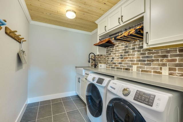 1305 Quail Ravine, Round Rock, TX 78664 - clothes washing area with independent washer and dryer, wood ceiling, ornamental molding, baseboards, and dark tile patterned floors