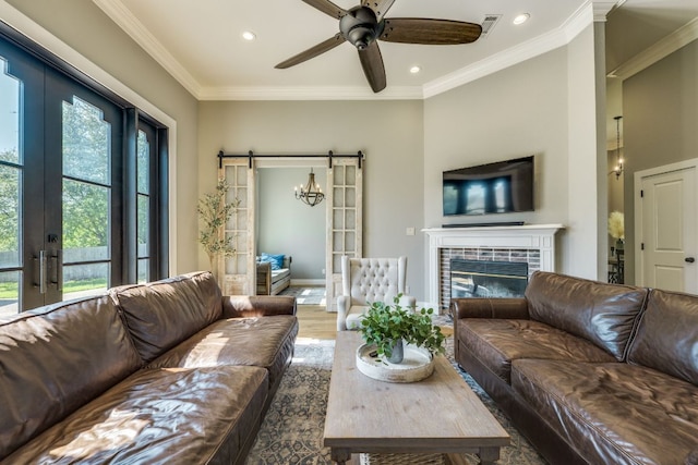 1305 Quail Ravine, Round Rock, TX 78664 - living area featuring recessed lighting, ceiling fan, wood finished floors, french doors, and crown molding