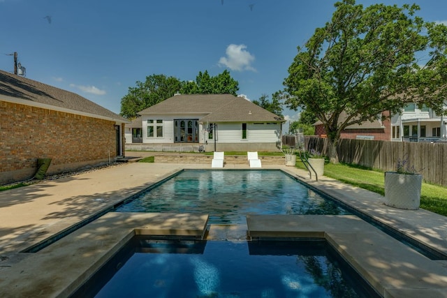 1305 Quail Ravine, Round Rock, TX 78664 - view of swimming pool with fence, a pool with connected hot tub, and a patio