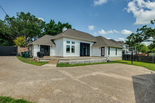 1305 Quail Ravine, Round Rock, TX 78664 - rear view of house featuring fence and a chimney