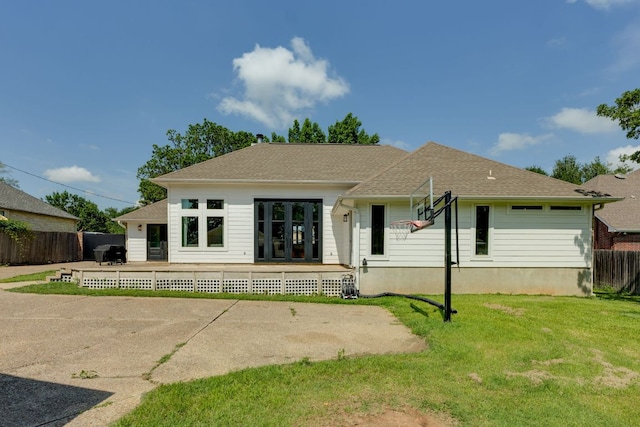 1305 Quail Ravine, Round Rock, TX 78664 - rear view of house with a wooden deck and roof with shingles
