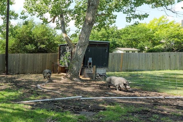 1305 Quail Ravine, Round Rock, TX 78664 - view of outbuilding with a fenced backyard and an outdoor structure