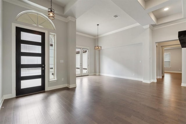 foyer featuring crown molding, dark wood finished floors, baseboards, and french doors