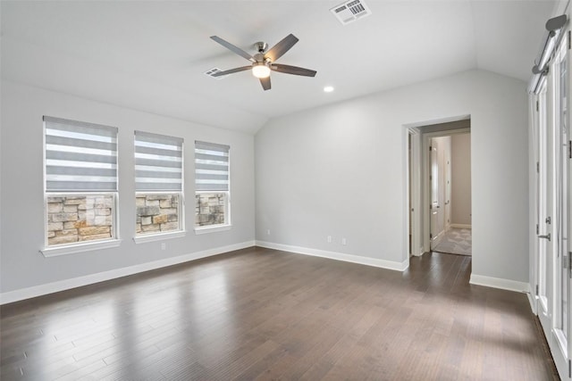 empty room featuring vaulted ceiling, a ceiling fan, dark wood-type flooring, baseboards, and recessed lighting