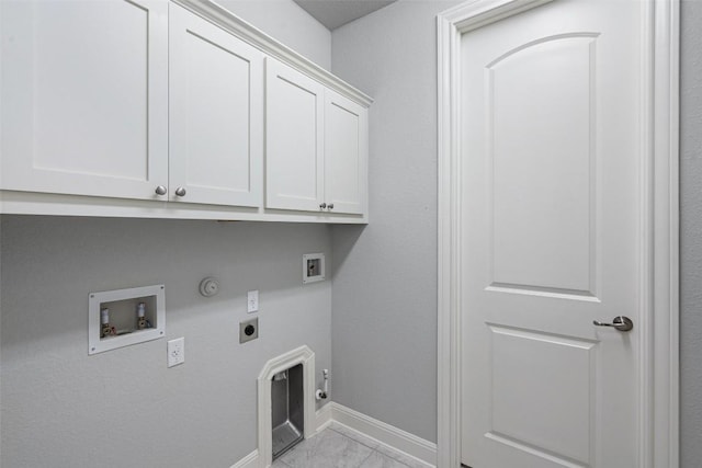 laundry room featuring gas dryer hookup, electric dryer hookup, hookup for a washing machine, and cabinet space