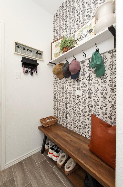 500 Pickrell Loop, Liberty Hill, TX 78642 - mudroom featuring baseboards and wood finished floors