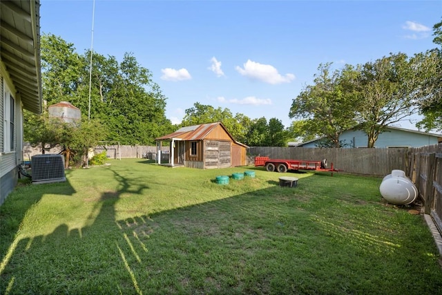 117 N Main St, Paige, TX 78659 - view of yard with central air condition unit and an outdoor structure