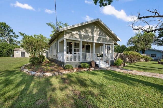 117 N Main St, Paige, TX 78659 - view of front of property featuring a porch and a front lawn