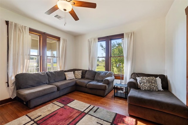 117 N Main St, Paige, TX 78659 - living area with wood finished floors and ceiling fan