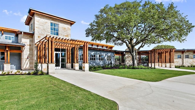 520 Betty Ann Way, Leander, TX 78641 - view of front facade featuring stone siding, a pergola, and a front lawn