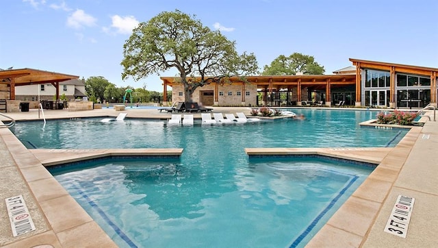 520 Betty Ann Way, Leander, TX 78641 - community pool featuring a hot tub and a patio