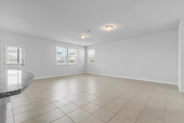 520 Betty Ann Way, Leander, TX 78641 - spare room with light tile patterned flooring and baseboards