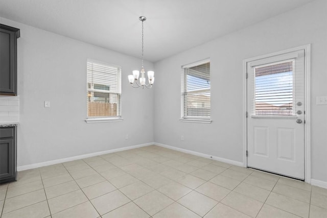 520 Betty Ann Way, Leander, TX 78641 - unfurnished dining area featuring a chandelier and baseboards