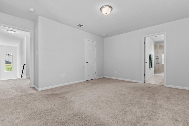 520 Betty Ann Way, Leander, TX 78641 - unfurnished bedroom with light carpet, baseboards, and ensuite bath