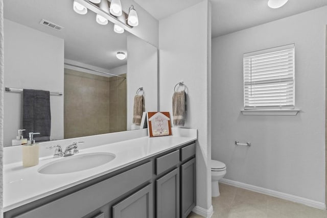 520 Betty Ann Way, Leander, TX 78641 - bathroom featuring toilet, vanity, tile patterned floors, a shower, and baseboards