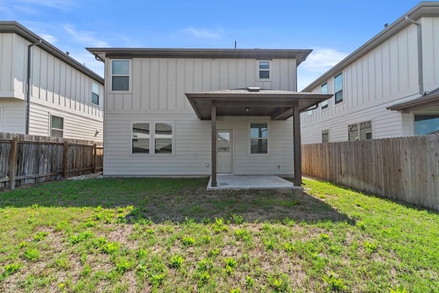 520 Betty Ann Way, Leander, TX 78641 - rear view of property featuring a patio and board and batten siding