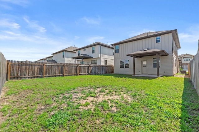 520 Betty Ann Way, Leander, TX 78641 - back of house with board and batten siding and a patio area