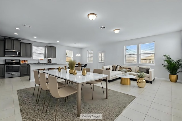 520 Betty Ann Way, Leander, TX 78641 - dining area featuring light tile patterned floors, recessed lighting, and baseboards