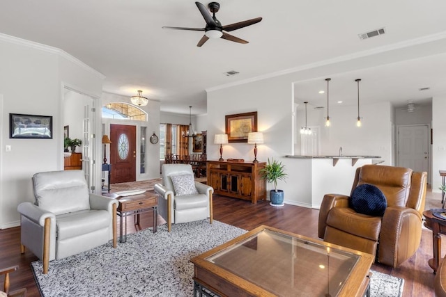 420 Oak Forest Dr, Buda, TX 78610 - living area featuring wood finished floors, a ceiling fan, ornamental molding, and baseboards
