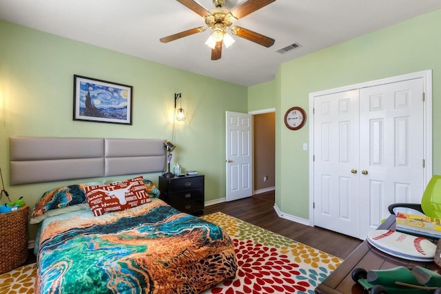 420 Oak Forest Dr, Buda, TX 78610 - bedroom featuring wood finished floors, a closet, ceiling fan, and baseboards