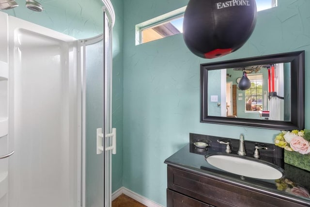 420 Oak Forest Dr, Buda, TX 78610 - bathroom featuring vanity, plenty of natural light, and a stall shower