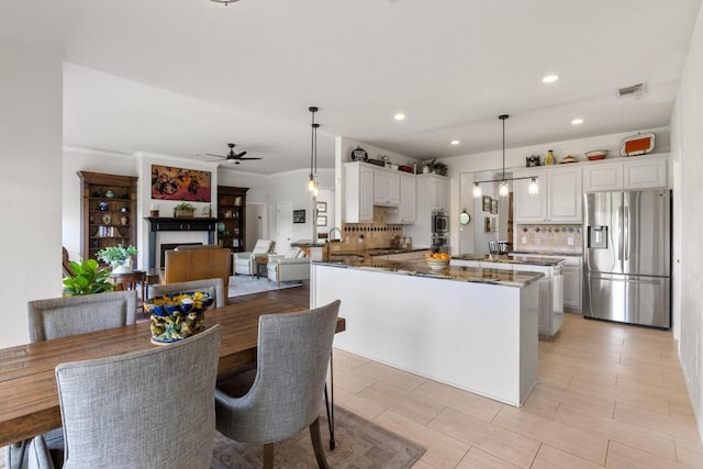 420 Oak Forest Dr, Buda, TX 78610 - dining room featuring ceiling fan and recessed lighting