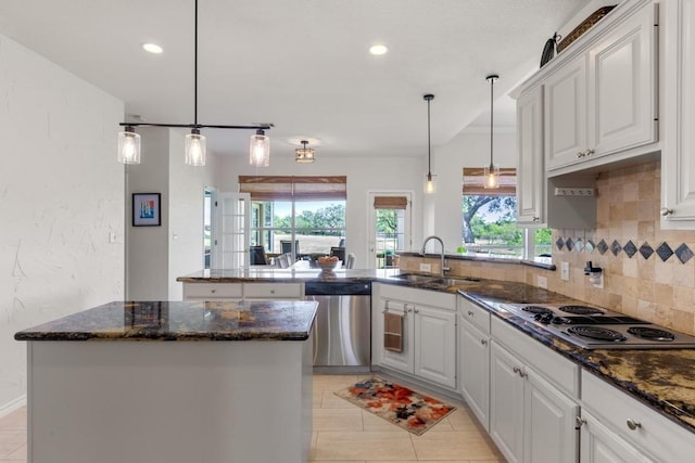 420 Oak Forest Dr, Buda, TX 78610 - kitchen featuring dishwasher, a sink, electric stovetop, a peninsula, and plenty of natural light