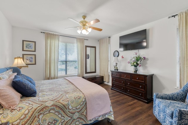 420 Oak Forest Dr, Buda, TX 78610 - bedroom featuring dark wood finished floors and a ceiling fan