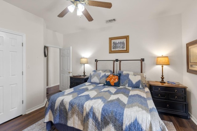 420 Oak Forest Dr, Buda, TX 78610 - bedroom with wood finished floors, baseboards, and a ceiling fan