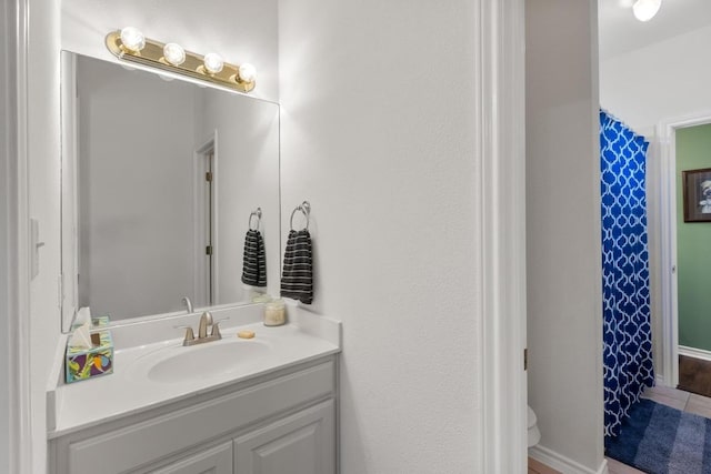 420 Oak Forest Dr, Buda, TX 78610 - full bath featuring vanity, toilet, and a shower with shower curtain