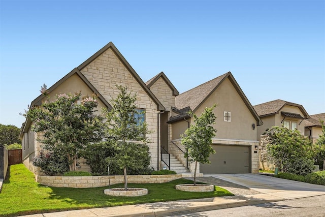 view of front of house with stone siding, stucco siding, concrete driveway, and an attached garage