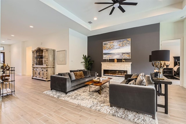 25727 Madison Rnch, San Antonio, TX 78255 - living room featuring a ceiling fan, light wood-style flooring, a fireplace, recessed lighting, and baseboards