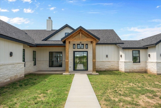 1754 County Road 146th Rd, Georgetown, TX 78633 - view of exterior entry featuring board and batten siding, stone siding, and a shingled roof