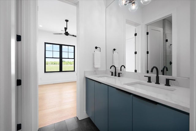 1754 County Road 146th Rd, Georgetown, TX 78633 - full bath with double vanity, a ceiling fan, and a shower stall