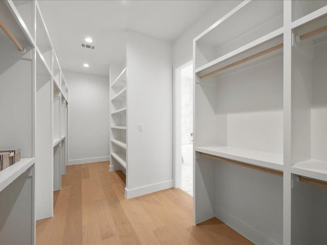 1754 County Road 146th Rd, Georgetown, TX 78633 - walk in closet with light wood finished floors