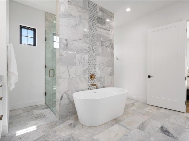 1754 County Road 146th Rd, Georgetown, TX 78633 - full bathroom featuring a shower stall, a freestanding bath, marble tiled flooring, recessed lighting, and tile walls