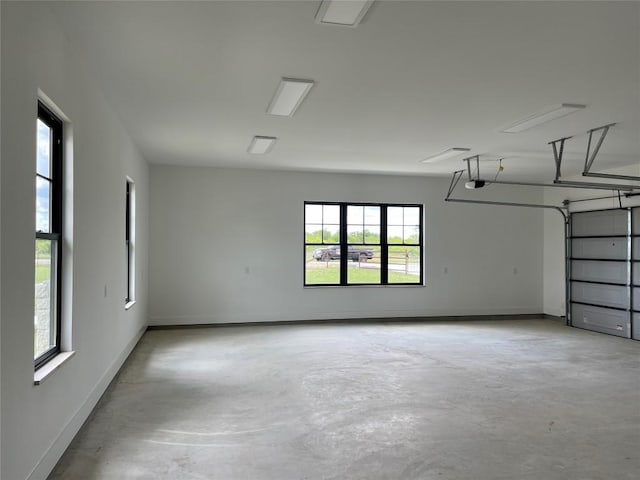 1754 County Road 146th Rd, Georgetown, TX 78633 - garage with a garage door opener and baseboards