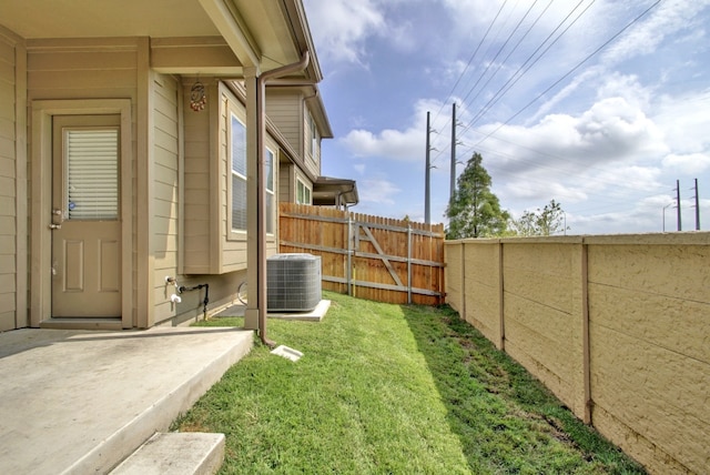 view of yard featuring central air condition unit