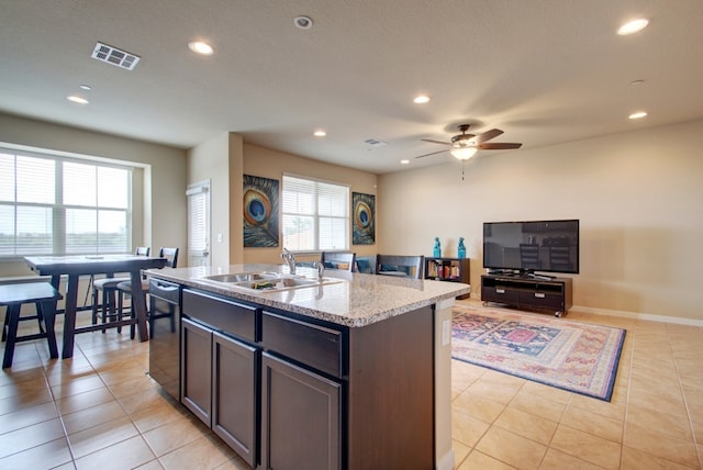 kitchen with a sink, dishwasher, recessed lighting, a ceiling fan, and light tile patterned floors